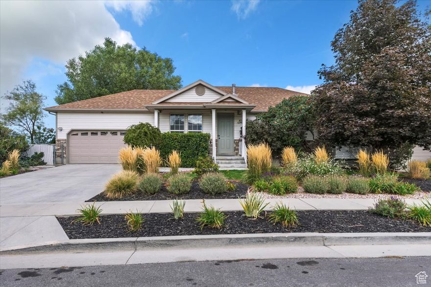 Charming rambler with walkout mother-in-law apartment in a desirable West Jordan Neighborhood offering excellent potential for rental income or multi-generational living. Step inside to discover an inviting open-concept kitchen with maple cabinets and new quartz countertops- perfect for culinary enthusiasts. The spacious Trex deck off the kitchen provides an incredible setting for outdoor dining and entertaining, offering stunning views from Mount Olympus to downtown Salt Lake City. The main floor, with 9-foot ceilings, enhances the sense of space and light. The main level primary bedroom features an en-suite bathroom complete with a relaxing tub, shower, and a spacious walk-in closet. The home has been thoughtfully updated with modern bathrooms, stylish flooring, and fresh paint throughout. The lower level is a cozy retreat, featuring a fireplace and an abundance of natural light, creating the perfect atmosphere for relaxation or entertaining. The quarter-acre mature yard is beautifully landscaped and well-maintained. Additionally, the home has a 2-car garage and a large shed with power, offering ample storage or workspace for your projects. Home is in close proximity to Oquirrh Highlands Park and Falcon Ridge Elementary School. Close to Mountain View Corridor and from Loadstone Park, with miles of running trails, a unique children's park, tennis courts, a baseball diamond, pickleball courts, and a zip line.  Be sure to check out the 3D tour link above.
