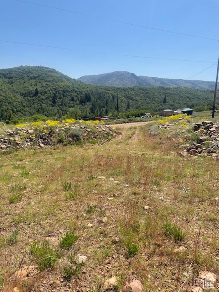 This 2.15 acre area is within minutes of Monte Cristo, Causey Reservoir, Pineview Dam ,the cities Huntsville and Eden. Adventures such as boating, skiing four-wheeling, snowmobiling, hiking, hunting, and access to trails are within reach ! The land is embedded within a hillside overlooking beautiful scenery and wildlife. The land is accessible via dirt road and has power and phone line capabilities. The land does not currently have a waterline hooked up or a septic tank. These properties are selling fast and as populated as Utah in becoming a listing like this won't last long.