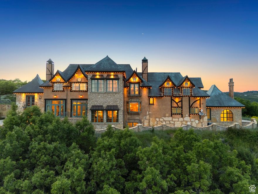 Some homes are built. This one was composed-note by note, stone by stone-by a master with a reverence for history and a fluency in silence. Perched high above Park City on over ten private acres, the Chteau on the Hill is a rare alignment of European lineage and Western vastness. Limestone cut by hand. Iron forged in fire. Views that don't just impress-they surround you. Inside, the architecture doesn't demand attention, it earns it: a staircase sculpted like a gallery piece, a dining hall shaped by light, a kitchen meant not just for cooking, but for ritual. Even the guest house speaks in its own voice-arched, vaulted, and entirely its own. This is not a home that fits into categories. It stands apart, timeless and unmoved. For those drawn not to ownership, but to stewardship- this is where the story continues. Total bedroom and bathroom count includes the 1 bedroom and 1 bathroom in the guest house.