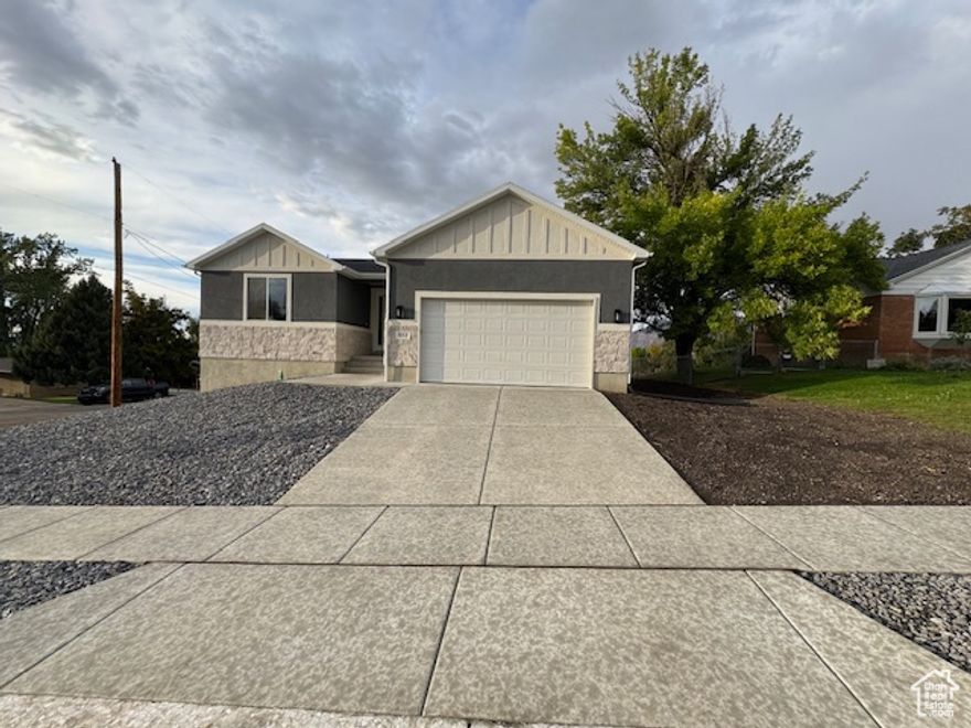 Modern comfort meets prime location in this stunning new construction home on a corner lot in South Ogden. Surrounded by established charm and incredible views, this 3-bedroom, 2-bath home offering single level living, features all the upgrades you've been wanting such as quartz countertops, a stunning primary en suite with double sinks and a walk in closet, a cozy fireplace in the great room, plus a high-efficiency HVAC, and tankless water heater. The walkout basement is already framed for an ADU with space for 2 more bedrooms, a full kitchen, and bath-ideal for rental income or multigenerational living. Minutes from everything. Absolutely must see!