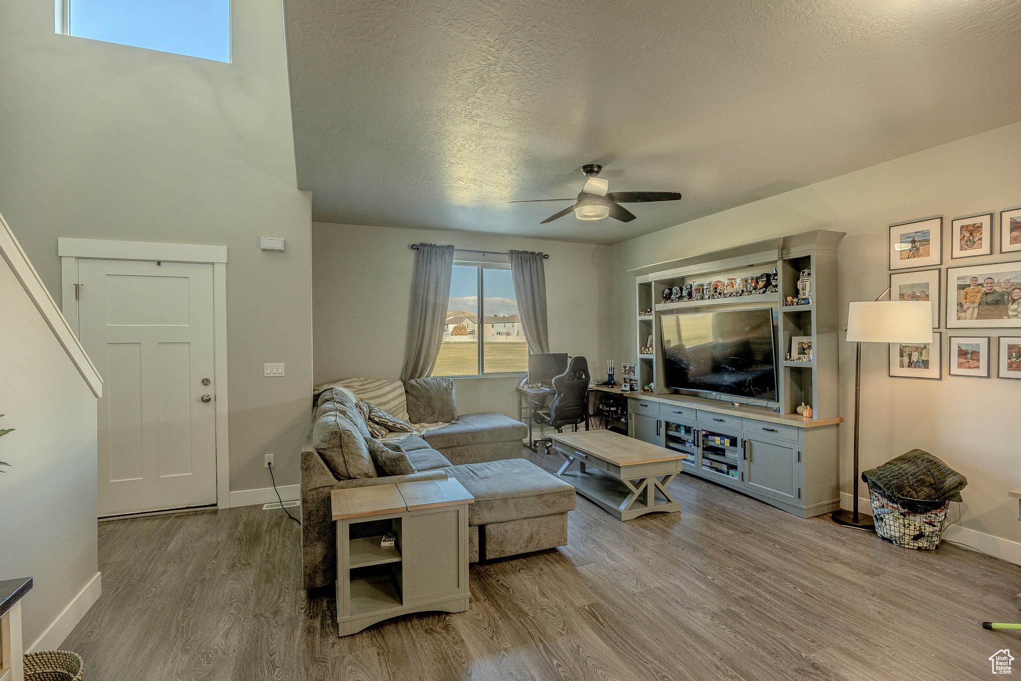 This stunning townhome in Eagle Mountain combines comfort, style, and convenience. Enjoy breathtaking mountain views with nearby parks, schools, shopping, dining, and endless outdoor activities just minutes away. Inside, you'll find 9' ceilings and an open-concept layout that feels bright and spacious. The kitchen features granite countertops, a gas range, ample storage, and durable LVP flooring-perfect for both everyday living and entertaining. The master suite offers a true retreat with upgraded lighting, a luxurious bathroom, and a generous walk-in closet. The unfinished basement provides endless possibilities-pre-plumbed for a kitchen and bath and equipped with upgraded electrical, making it ideal for a future entertainment space. Additional highlights include a two-car garage with extra storage and a fridge that is negotiable. This home shows like a model and is truly a must-see! Square footage figures are provided as a courtesy estimate only and were obtained from tax records. The buyer is advised to obtain an independent measurement.
