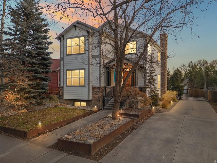 Located in the heart of urban Salt Lake City, this home is very near the University of Utah with exceptional access to campus, major hospitals, and downtown. Multiple coffee and tea shops are just steps away, including one directly across the street, offering true walkable city living. Walkable access to nearby private school campuses, in addition to public school options The home features an open floor plan  with 9-foot ceilings on all three levels, creating a bright and spacious feel throughout. The main level includes a private ensuite bedroom along with a convenient powder room, ideal for guests or main-level living. The lower level offers a full apartment with a separate entrance and its own laundry space, perfect for rental income, multigenerational living, or a private guest suite. Additional highlights include extremely rare three-car garage for the area, complete with a power gate.Surrounded by tree-lined streets, local dining, nearby parks, and easy access to TRAX and freeway connections, this property delivers authentic urban Salt Lake living with flexibility, convenience, and long-term value.  Square footage is provided as a courtesy estimate from prior MLS records. Buyer to verify all information, including square footage, through independent measurement.