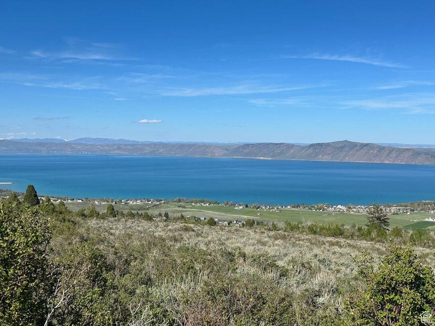 Rare opportunity to own a 1.91-acre view lot in Sweetwater overlooking beautiful Bear Lake in Garden City. This premier homesite offers sweeping panoramic views of the entire lake and surrounding mountains, providing the perfect setting for your dream cabin or year round home. Located just minutes from the trailhead with direct access to miles of ATV/UTV and snowmobiling trails, making it an outdoor enthusiast's paradise. Enjoy the peaceful mountain setting while still being close to the marina, golf course, and the amenities of downtown Garden City. Nightly Rentals are not permitted, helping preserve the quiet, residential atmosphere of the neighborhood. Don't miss this chance to own a large Bear Lake view lot in one of the most desirable communities.