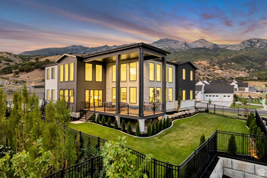 MOTIVATED SELLER - $800K INSTANT EQUITY  Appraised at $4.3M, listed at $3,500,000! Discover refined mountain living in one of Alpine's most sought-after neighborhoods. This 9,526 sq. ft. custom-designed estate was created to capture and frame the stunning views. Featuring a 4-car garage, RV pad, and fully fenced, landscaped yard, this home blends elegance with function. The Great Room boasts soaring 22' coffered ceilings and expansive windows that invite the outdoors in. A gourmet kitchen plus second prep kitchen make entertaining seamless, while a private theater with 7.2 Dolby surround, personal gym, and spacious gathering areas create spaces to connect and unwind. The Primary Suite is a true retreat with spa-like finishes and radiant heated floors. Designed for both grand entertaining and quiet moments, this estate offers the perfect balance of luxury and lifestyle.