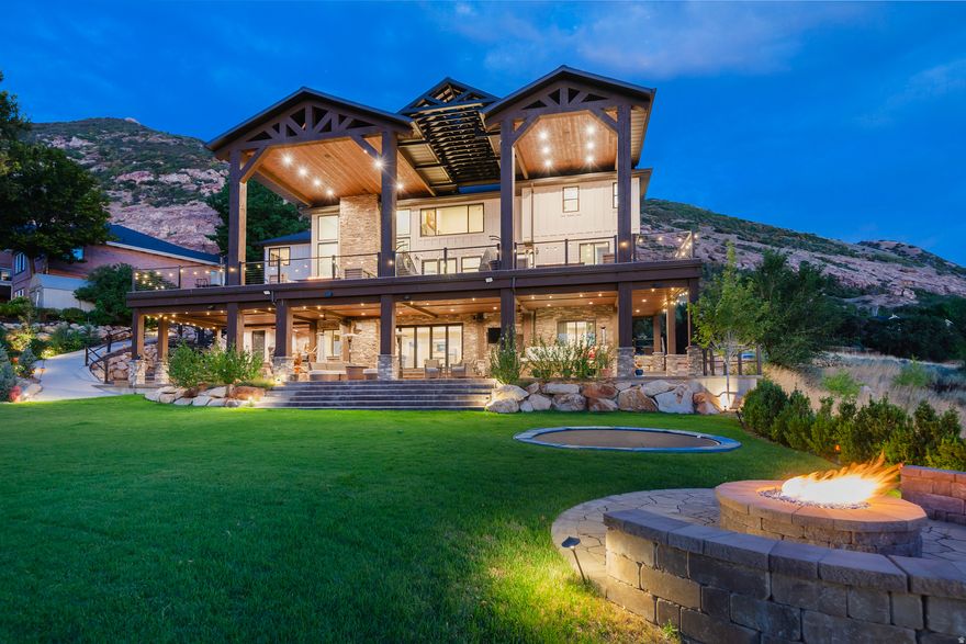Spectacular Draper Luxury Home with One-of-a-Kind Views Better than new, this fully renovated masterpiece offers unparalleled panoramic golf course and mountain views through oversized windows and expansive Caribbean doors. Enjoy over 2,500 sq ft of decks and covered patios, complete with a relaxing hot tub, tranquil water feature, and mature fruit trees. Inside, the dramatic two-story granite fireplace anchors the open living area, while the gourmet kitchen impresses with high-end finishes, a hidden pantry, and premium appliances. The walk-out lower level boasts a state-of-the-art theatre room and direct backyard access, perfect for entertaining. A backup generator provides added peace of mind. Every detail has been crafted for luxury, comfort, and entertaining, making this home a rare find in Draper. *Square footage provided as a courtesy. Buyer is advised to obtain independent measurements and verify all information.*