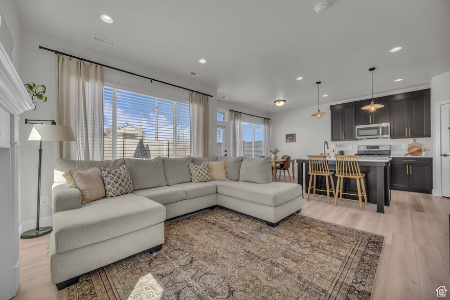 Come step into this beautifully crafted 4-bedroom, 3-bath townhouse that seamlessly blends contemporary design with everyday comfort. The open-concept living area is bathed in natural light, highlighting the luxury vinyl plank flooring. The kitchen features quartz countertops and stainless steel appliances, Upstairs, the spacious primary suite offers a tranquil retreat with a walk-in closet and an ensuite bathroom. Three additional bedrooms provide ample space for family, guests, or a home office. Additional highlights include a private patio perfect for outdoor entertaining, an attached two-car garage, and energy-efficient features throughout. Schedule a private tour today! Square footage figures are provided as a courtesy estimate only. Buyer is advised to obtain an independent measurement.