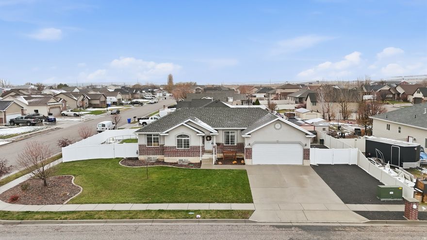 Get ready to start the holidays and the new year in your beautiful new home! This move-in-ready property features a newly finished 100% complete basement (2021) with a spacious rec room, family room, and generously sized bedrooms with larger closets. Offering 6 bedrooms and 3 full bathrooms, this home is located in a quiet Tremonton neighborhood close to schools and shopping. The seller is including the 10x12 backyard shed and has made several recent upgrades, including a new water heater, garage door, furnace, and AC. The property is already connected to secondary irrigation water, helping reduce your summer watering costs. Enjoy a large corner lot with a fully fenced backyard, plus plenty of gated space for RV parking and all your toys. You'll feel right at home the moment you walk through the door! Buyer to verify all information.
