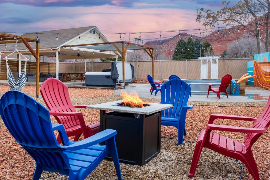 Welcome to Venture Base! This turnkey short- and mid-term rental complex is just one block from Kanab's vibrant Main Street and adjacent to the brand new city recreation center. Spread across two parcels with three well maintained buildings, the property features an attached garage, covered patio, carport, hot tub, fenced dog park, and a shared hammock lounge. Guests also enjoy a charming "cowboy pool" for cooling off and relaxing. Ideal for investors or owner-operators, Venture Base combines excellent location, strong amenity appeal, and flexible rental potential. There is also an opportunity for development on the second parcel. There are 3 buildings on these two parcels for a total of .80 acres Building 1 = 4 units (common laundry area) Building 2 = 1 unit (laundry area) Building 3 = 2 units (common laundry area)  Square footage figures are provided as a courtesy estimate only and were obtained from appraisal.  Buyer is advised to obtain an independent measurement.