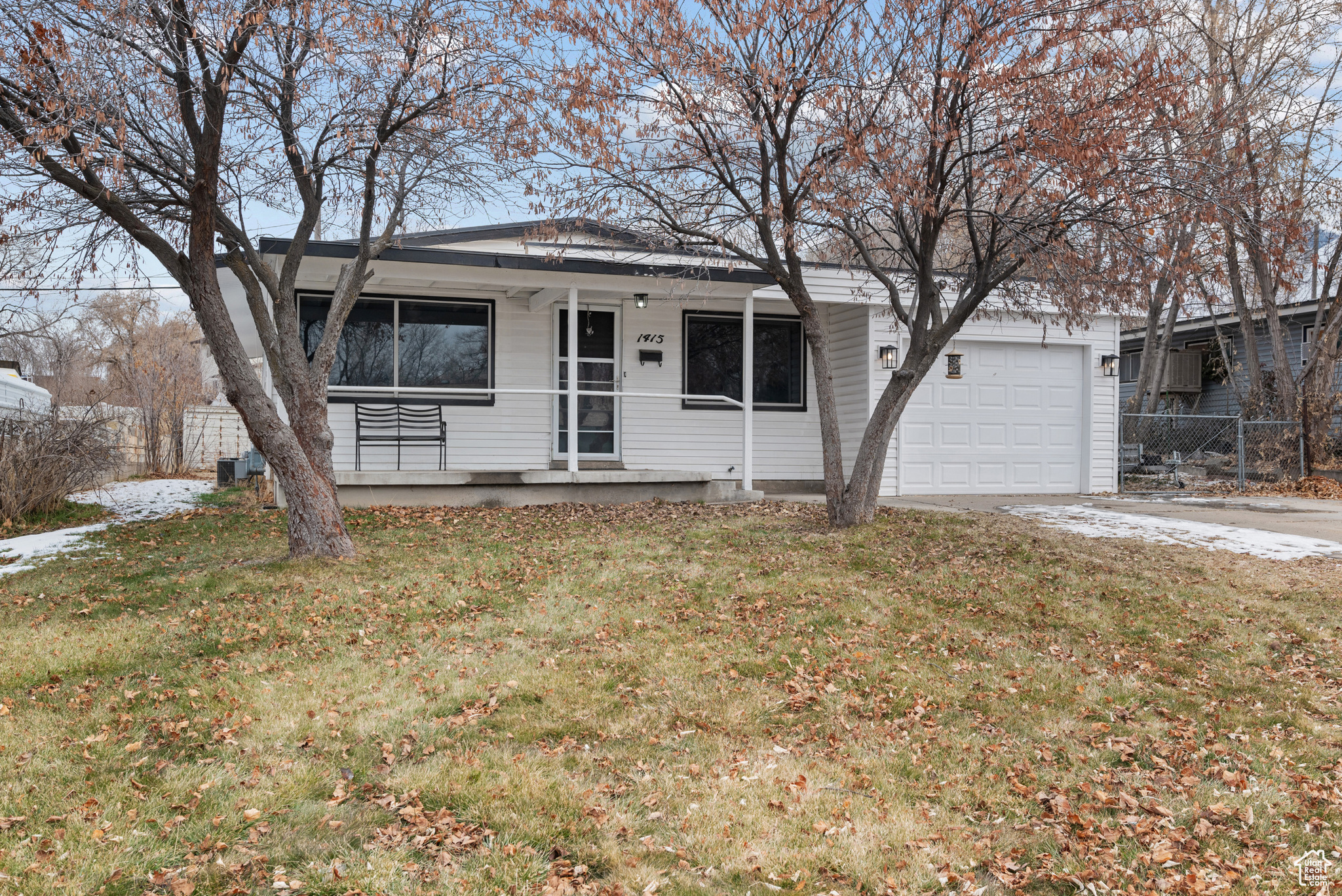 **Open House Saturday Feb 8**  Step inside this beautifully updated home, where modern upgrades meet warm, inviting style. The kitchen shines with brand-new quartz countertops. You'll love the generously sized bedrooms, providing comfort and space rarely found in a home this size.  The extra-deep 500 sq. ft. garage is perfect for storage or a workshop. The backyard features an additional storage shed, giving you even more room to stay organized. Come spring, the front yard bursts with stunning pink blossoms on the trees!