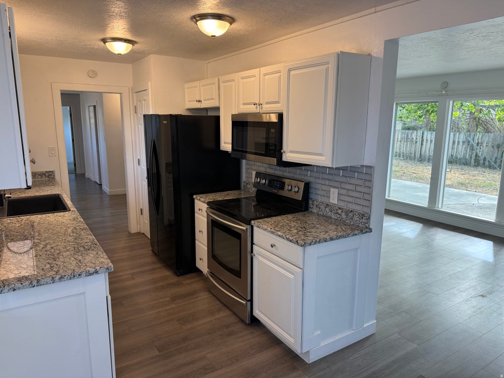 Photo of 468 PIONEER AVE, Tooele, UT 84074 (MLS # 2186257)