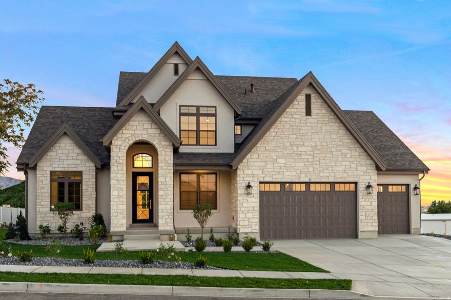 This stunning Accord XL by Symphony Homes commands attention along Main Street and delivers true model-home luxury at every turn. Originally designed as a showcase residence, it is richly upgraded with bespoke finishes, custom millwork, and on-trend designer selections throughout.  The gourmet kitchen is a showpiece, featuring a built-in refrigerator and freezer, 48" professional gas range with pot filler, and an oversized walk-in butler's pantry. The primary suite is nothing short of spectacular, with a dramatic tray ceiling, custom dressing room, and a spa-inspired bath that truly wows.  Soaring two-story ceilings and decorative grid beams anchor the family room, while the loft overlook adds architectural drama. All upstairs bedrooms include walk-in closets and convenient upper-level laundry.  The finished basement elevates entertaining with a private gym, open theater space, and designer wet bar. The garage is fully finished with epoxy floors, and the rare 40-foot deep third bay offers unmatched flexibility. Brand new, fully landscaped, and impeccably executed-this home is a statement of craftsmanship, luxury, and modern elegance.