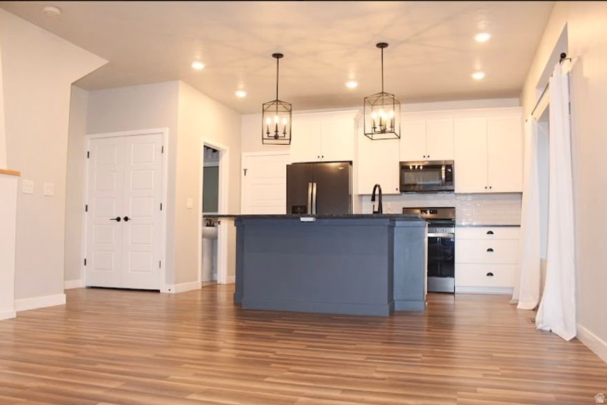 This near-new three-bedroom, three-bath townhome blends modern design with thoughtful custom details throughout. Inside, you'll find elevated finishes like shiplap accents, a warm fireplace, custom shelving and cabinetry, and an inviting porch swing that adds real character. The layout is open, functional, and designed for everyday living as much as entertaining. Step outside your front door and enjoy access to a well-appointed clubhouse and a large resort-style community pool-perfect for relaxing or hosting guests. Low-maintenance, highly upgraded, and move-in ready, this home delivers comfort, style, and lifestyle in one clean package.