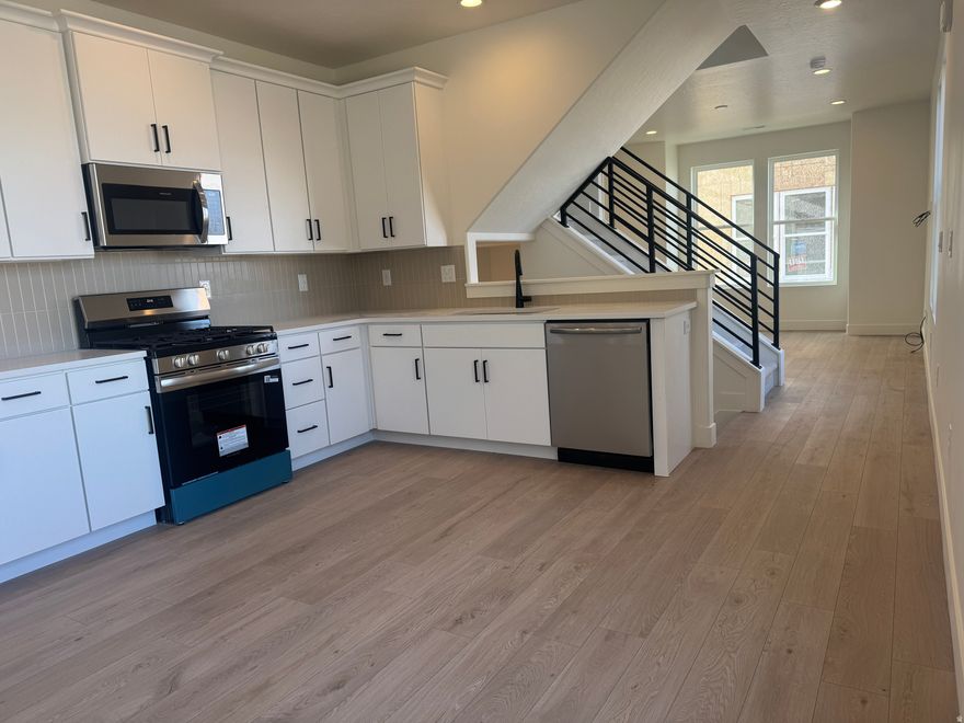 Last End Unit!!  The Manhattan-Sky. Be Part of the Excitement in the New Downtown Daybreak Community, only a Short Walk from the Bee's Ballpark. This Stylish 3-Bedroom, 2.5-Bath Home with a Flex-Room is Designed with 9-Foot Ceilings on Every Floor and Open Railing for a Bright, Elevated Feel. The Highlight is the Private Roof Deck, Offering Beautiful Views of Downtown Daybreak - the Perfect Spot to Relax, Entertain, and Take in the Energy of the Community. Home at Framing, Estimated Completion Aug/Sept. 2026. **Interior Photos are of Another Home and not of the actual Property.