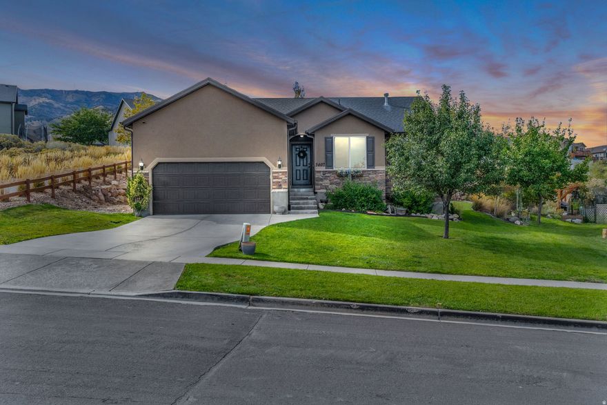 Preferred lender is offering a 1/1 buy down to help you get the best interest rate possible! Use it toward closing costs or an interest rate buy-down to get the perfect payment. Welcome to your beautiful 4-bedroom rambler, perfectly situated to capture stunning lake and mountain views. This home has been lovingly maintained and is ready for its next owner to call it home. Enjoy peaceful evenings in the spacious backyard, enhanced by elegant LED lighting-ideal for outdoor dining or entertaining under the stars. Inside, the open and inviting floor plan provides comfort and functionality, while the large basement offers plenty of space for gatherings, recreation, or future customization.   Square footage figures are provided as a courtesy estimate only and were obtained from county records. Buyer to verify all.
