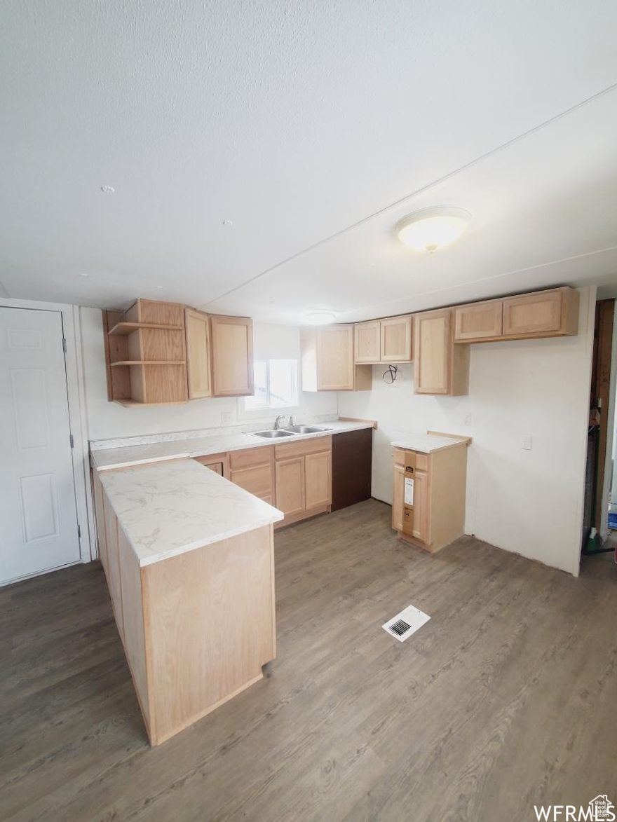 Newly remodeled mobile home. Three bedrooms and 1 bedroom and new windows. Call for your private showing. New owners will be required to have a background check done by the HOA. Sq ft are provided as a courtesy estimate only. Come check it out!