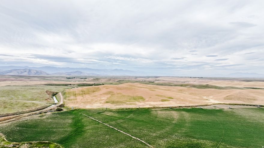 Motivated seller. Water right #13-2247 1.73 cfs for 520 acres was added to the listing. This can be sold separately. Looking to get a functional diversified farming operation or add to your operation. This is great farm ground, 220 +/- irrigated acres are flat and don't require as much water as most properties to produce 6 tons per acre. There are 3 new Valley cell ready pivots, 3 wheel lines and a new 125 horse pump. The system is sized and planned and there is enough water for two more pivots. This acreage is planted in alfalfa and wheat. (plus a water right and well for 520 additional acres) there is another 989 +/- acres of the quality dry farm. Twin Lakes Canal runs through this property. This property sits on both sides of 1200 W and Mail Rout Road. Battle Creek runs through this property. Multiple tax ID numbers. See the virtual tour for an interactive map of the property.