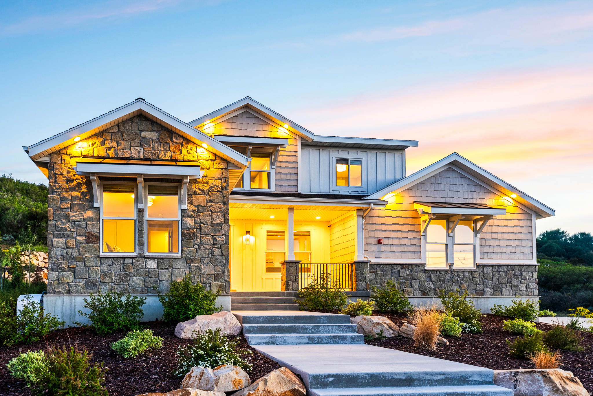Stone and siding exterior with gabled roof lines