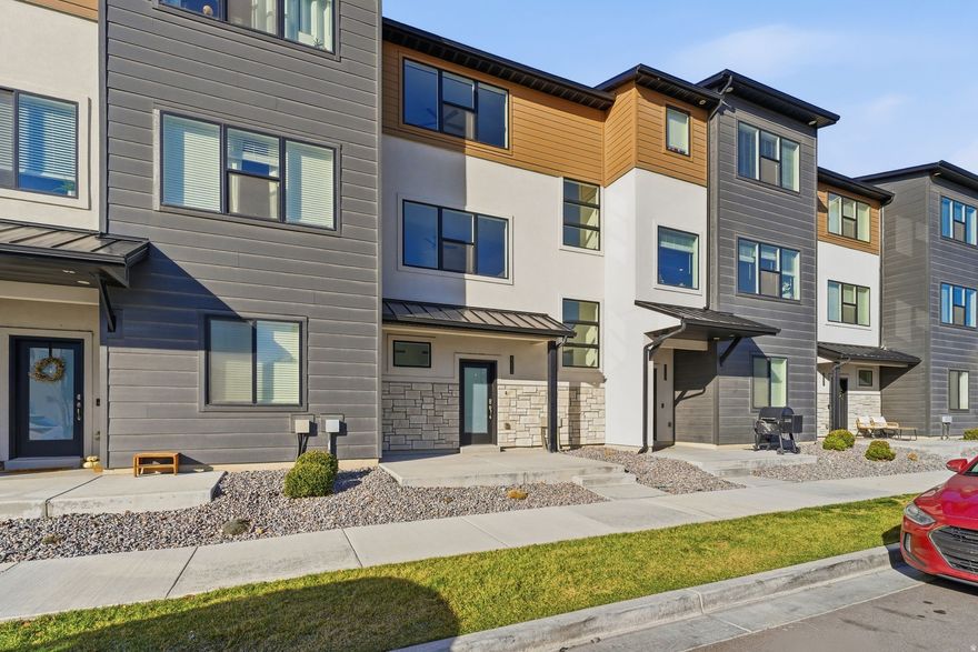 Don't pass up on this beautifully upgraded 3-bedroom, 2.5-bath townhome with stunning views! Open-concept main level is filled with natural light and features quartz countertops, a custom tile backsplash, and updated hardware throughout the property, creating a clean, contemporary feel. Upstairs, the spacious primary suite provides a private retreat, while two additional bedrooms offer flexibility for family, guests, or a home office. A tankless water heater ensures energy efficiency and endless hot water with an attached two-car garage adds convenience and extra storage. Ideally located near shopping, dining and commuter routes, this home combines low-maintenance living with high-end finishes and a prime setting. Square footage figures are provided as a courtesy estimate only and were obtained from prior MLS.  Buyer is advised to obtain an independent measurement.