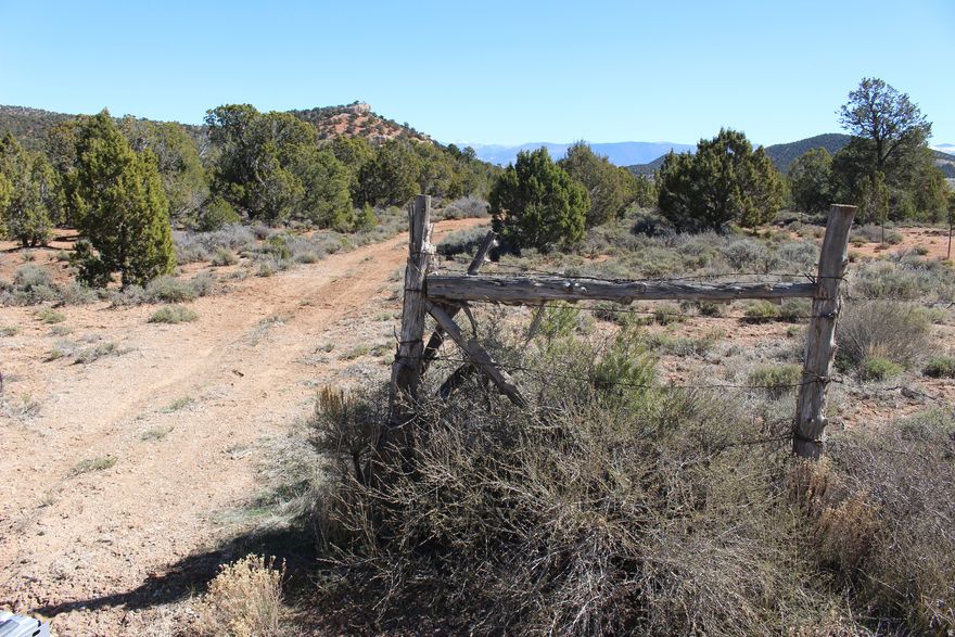 20 acres west of Cedar City with year-round access and wide-open Southern Utah views. Located along the Highway 56 corridor approximately 14 miles from town, this A-20 zoned parcel offers a flat to gently sloped terrain with natural sagebrush and open space, giving buyers a great opportunity for a rural homesite, recreational getaway, or future land investment. Convenient access and room to spread out make this a strong option for anyone looking to enjoy privacy while still being within reach of Cedar City. Buyer to verify zoning, utility availability, water rights, and permitted uses.