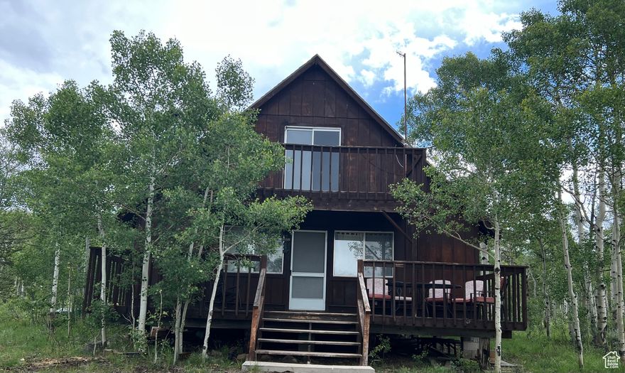 AMAZING Cabin Retreat, Open Floor Plan, Year Round Adventures,  Riding trails, Nearby fishing, Winter Wonderland for SnowMobiling .  Three BedRooms, Bedrooms Have Electric Baseboard Heater's.  Loft, Balcony's. Great Kitchen, Full Bath. Newer Roof. Cozy up by the Wood Stove to Share the Days Adventures.   OR Roasting Marshmallows Ou tBack, Surrounded by MotherNatures Best as you gather around the Built inFIRE PIT.    RELAX  REFILL ENJOY Making Memories! BONUS Features.  The Property has their OWN WELL!    ALSO  An INCREDIBLE 2.78 of an Acre !!!!  Open Slate !