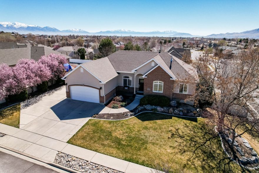 Welcome to a one-of-a-kind opportunity in one of Lehi's most desirable and convenient locations. Tucked away on a quiet cul-de-sac lined with mature trees, this beautifully remodeled home offers the perfect blend of privacy, space, and elevated design. Every inch of this home has been thoughtfully updated by a professional interior designer, featuring high-end finishes, stylish details, and a cohesive look you simply won't find in typical remodels. From the moment you walk in, you'll notice the light, open feel and the attention to detail that makes this home truly stand out. Sitting on a .35 acre lot, there's plenty of room to enjoy the outdoors-whether it's entertaining, gardening, or just relaxing in your own private space. The fully finished basement adds incredible flexibility with potential for an ADU or mother-in-law suite, making it ideal for multi-generational living or added rental income. Located just minutes from shopping, dining, schools, and freeway access, this home offers the convenience everyone wants-without sacrificing peace and quiet. Homes like this-with designer finishes, a large lot, and ADU potential, at this price in central Lehi-are incredibly hard to find. Come see it before it's gone.