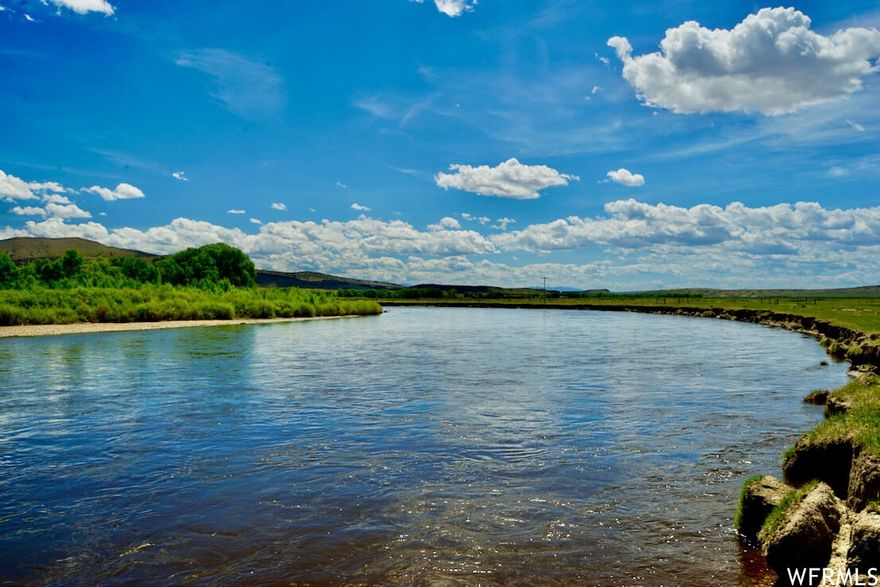HISTORIC HAYSTACK RIVER RANCH: NORTH PLATTE RIVERFRONT LEGACY 92,447 Acres | Miles of North Platte Riverfront | Profitable Cattle Operation | Premier Wyoming Recreation  A rare opportunity to acquire one of Wyoming's most significant ranch holdings, where legendary Western history meets modern investment potential. Haystack River Ranch combines productive agriculture, world-class recreation, and multiple revenue streams in an iconic Wyoming landscape. PROPERTY HIGHLIGHTS   92,447 Total Acres: 25,000 deeded acres, 40,960 BLM permitted acres, 23,527 private lease acres Water Resources: Miles of North Platte River frontage, hundreds of irrigated/sub-irrigated meadows, 30 stock ponds, numerous springs Proven Production: Supports 9,000+ AUMs with low overhead operations Complete Infrastructure: Two homes, calving/vet barn, feedlot, horse barn, outbuildings Current Income: Multi-year cattle lease providing immediate return on investment Investment Potential: Wind rights, carbon credits, conservation easements, recreation development Premier Recreation: Trophy fishing for browns, rainbows, cutthroats and walleye; excellent big game hunting (elk, pronghorn, mule deer); upland birds and waterfowl  OPERATIONAL FEATURES  Historically operated with cattle wintering in the southern portion and summer grazing in the north, with supplemental feeding typically December through April. Recently successful as a yearling operation. The diverse landscape at 7,000 feet elevation creates the perfect "Wyoming mix" of river bottomlands, irrigated meadows, sagebrush uplands, and rocky mountain terrain. LOCATION & ACCESS  Located just outside Rawlins (population 8,000), with full amenities including hospital, retailers, and restaurants. Excellent accessibility via Interstate 80 and Rawlins Municipal Airport. Near the famous "Miracle Mile" fishing destination and Seminoe Reservoir. This extraordinary property embodies the authentic Western legacy, standing at the crossroads of Wyoming's storied past of Native Americans, fur trappers, railroaders, and outlaws. Haystack River Ranch offers not just a cattle operation, but a piece of American heritage with substantial appreciation potential.