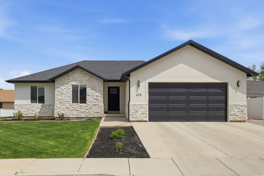 Skip the build time with this barely-lived-in rambler in the heart of East Ephraim. Perfectly situated on a south-facing flat lot, this home offers an open floor plan with vaulted ceilings, stunning mountain views, and a recently finished basement. The kitchen is designed for entertaining, featuring granite countertops, a gas range, a large island bar, and abundant cabinetry.  The spacious owner's suite includes a high-end, XL custom-tiled shower, while the oversized laundry and mudroom provide a functional transition from the garage. The exterior is fully move-in ready with recently completed landscaping, automatic sprinklers, and a dedicated plumbed garden area. Additionally, extra rock work has been added to the side of the garage to provide convenient off-street parking. Located just minutes from Snow College, local schools, and restaurants, this property offers "like-new" quality with every upgrade already in place.