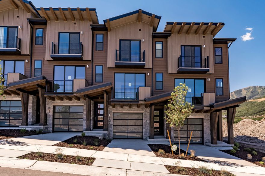 Welcome to The Pointe at Current  Where Modern Innovation Meets Mountain Resort Living! Tucked in the breathtaking Wasatch Mountains between Park City and Heber City, this exceptional townhome combines luxury living with cutting-edge, eco-friendly design along the west side of Jordanelle Reservoir. Enjoy easy access to premier hiking and biking trails, world-class skiing and snowboarding, and the year-round recreation of Jordanelle Lake.  A private underpass beneath SR-450 connects directly to Deer Valley Resort, offering seamless access to the heart of mountain adventure. Built to meet the U.S. Department of Energy's Zero Energy Ready Home standards, this residence is crafted for superior health, comfort, and efficiency. With advanced insulation, energy-recirculation systems, and solar-E windows, the home maximizes natural light, maintains optimal comfort, and significantly reduces utility costs.  Inside, you'll find sleek quartz countertops, designer cabinetry, and durable, stylish flooring that beautifully balances form and function. Step onto your private balcony to enjoy crisp mountain mornings, or retreat to one of two luxurious primary suites on the third floor-including a grand suite with its own outdoor space to take in the sweeping natural views.  Don't miss your opportunity to own this "Home of the Future" in one of Utah's most desirable locations. The HOA allows nightly rentals, making this an ideal option for both personal use and investment potential.