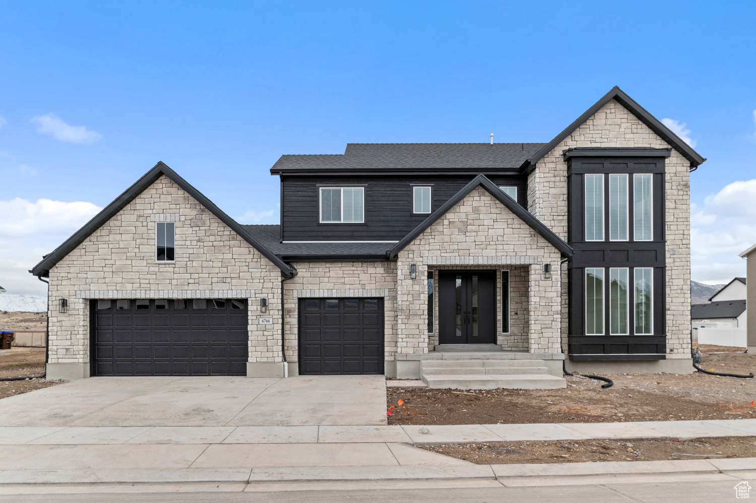 Come see this gorgeous brand new Brinton home that offers a refined blend of luxury and functionality. The chef's kitchen is a showstopper with maple cabinets featuring large crown molding, granite countertops, and premium stainless steel gas appliances, creating a space that's both stylish and practical. This home boasts laminate hardwood, tile, and carpet flooring, a spacious 3-car garage with an exit door, and thoughtful upgrades like a water softener and tankless water heater for modern convenience. Custom features include a barn door leading to the owner's bathroom, an upstairs loft, and bedroom 5 replacing the office, offering maximum versatility. Additional highlights include tile surrounds in bathrooms, black matte hardware, textured walls, and 2-tone paint for a sophisticated interior. The gas log fireplace in the family room adds warmth and ambiance, while the Entrada base and casing lend timeless craftsmanship throughout. This elegant and thoughtfully designed home is one you do not want to miss out on!