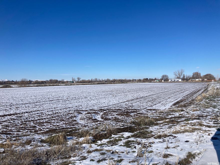 GREAT OPPORTUNITY.  Flat Land.  41.28 acres on the corner of 4700 W and 5500 S in Hooper.  Current zoning permits for 1 acre building lots.  This city's new Future Land Use Map shows that the south side of the property located along 5500 S can be zoned commercial, and the portion to the north can be zoned 3/4 acre lots.  The future of this parcel shows great possibility with the future of Legacy Highway and the widening of 5500 south to accommodate future growth and traffic flow.  *See Agent Remarks.