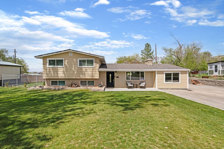 Looking for land and a shop to put all your toys and equipment? Look no further! This stunning home rests on a quiet street in the heart of Payson! Spotless, well cared for, and updated throughout. Full kitchen remodel was completed in 2021 and all the appliances will be included in the sale. Entire home is equipped with a carbon water filtration system, which provides clean and purified water throughout the home. Basement primary bedroom is spacious with a 3/4 bathroom, laundry room, walk-in closet and extra storage room. This home was made for entertaining with its extra bonus family room, with beautiful wood accents, tons of natural light, exterior entrance and storage room in the back. French doors lead to large cement patio, private and fenced yard. 20x20 shop/detached garage features 240 power and its own panel. RV parking is big enough for full size RV AND all of your toys. Deluxe chicken coop is included with the home, along with the custom swing set. Other important updates include new furnace in 2022, water heater in 2020 and carpet in 2023. Come and enjoy country living with the proximity of all major shopping!