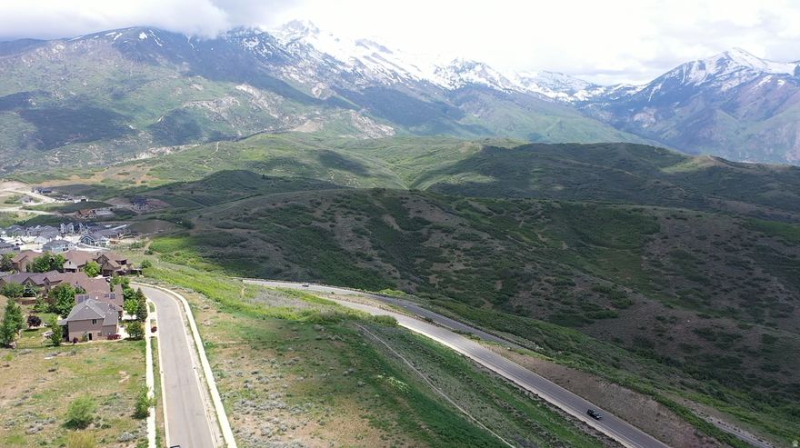 Build your dream estate and enjoy unobstructed views of Utah Lake, Mt. Timpanogos, and Lone Peak in Draper's Mountain Community of SunCrest. The abutting conservation easement to the South ensures the only back yard neighbors you will ever have are abundant mountain wildlife. Listing includes two lots which can be combined for a total of .348 acres. This location offers a rare opportunity to build where captivating scenery takes center stage, while offering the convenience of easy commutes: 8 minutes to I-15, 30 minutes to the international airport and downtown Salt Lake City, 35 minutes to world class skiing/riding. The allure of this property extends beyond its stunning views and location. With world-class hiking and mountain biking from your door, don't miss the opportunity to call this mountain paradise your own. Embrace a lifestyle defined by extraordinary views and serenity. This listing includes tax IDs 38-334-0110 and 0109. Initial GeoTech Engineering report is attached to the MLS. Available information indicates stabilization required of these lots. All info provided as a courtesy. Buyer/Buyer's Agent to verify all.