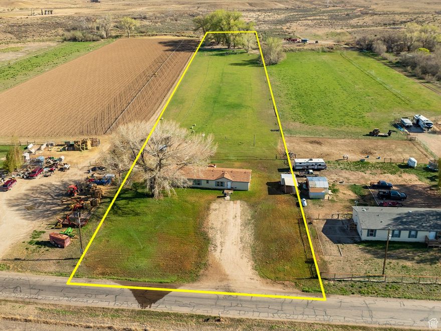 Located just a short 12-minute drive from the heart of Roosevelt, this private horse property boasts 5 acres (2.5 irrigated acres, on BIA water), and includes 22 40' hand lines!!! This 2,052 sqft home features 5 bedrooms, 2 bathrooms, 2 family room's, and a living room. The exterior features corrals, sheds, mature trees, and a shared irrigation pond. Enjoy the convenience of a manual home sprinkler system which covers the entire front yard, enjoy the peaceful sounds of the irrigation canal that gracefully runs through the back of the property. USDA wheel-line application has been made to replace the hand-lines. Call Listing agent for an appointment to see this property today! Square footage figures are provided as a courtesy estimate only and were obtained from county records. Buyer is advised to obtain an independent measurement and verify all information.