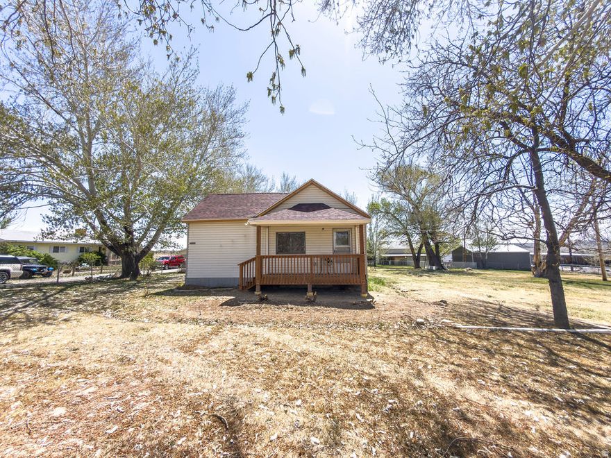 Step onto the inviting new front deck and into this beautifully updated home, where modern upgrades meet country charm. Inside, you'll find stunning reclaimed 3/4" oak floors, fresh paint throughout, and a bright, refreshed interior that feels both warm and move-in ready. The kitchen is tastefully upgraded with new countertops, backsplash ( coming soon), and sinks with updated faucets, while the bathroom features stylish tile flooring, a new toilet, and updated fixtures. Comfort continues with new carpet in the main bedroom and baseboard trim throughout for a clean, finished look. Major improvements provide peace of mind, including a brand-new electrical system inside and out and a new roof that has been finished with durable 30-year shingles. Situated on a spacious lot with mature trees and a welcoming covered porch, this home offers the perfect blend of quality updates and everyday livability. Square footage figures are provided as a courtesy estimate only and were obtained from county records . Buyer is advised to obtain an independent measurement.