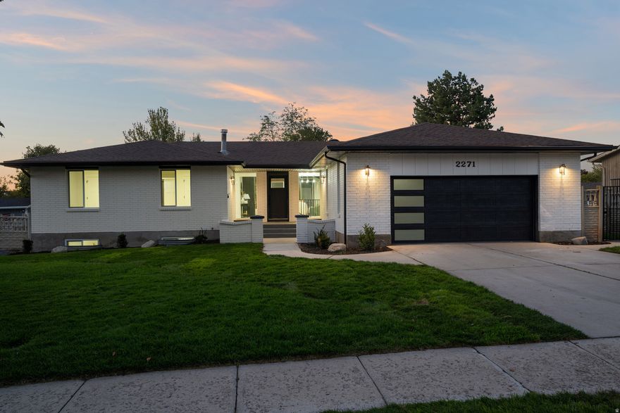 This stunning, fully renovated home is located just minutes from the prestigious Willow Creek Country Club, nestled in one of the most desirable pockets of the Salt Lake Valley. With breathtaking mountain views, a spacious layout, and designer finishes throughout, this property is a rare find. Boasting over 4,000 square feet, the home features six bedrooms, including a fully finished basement with a separate kitchenette, perfect for entertaining, extended guests, or multigenerational living. The heart of the home is an expansive great room with soaring ceilings and exposed beams, creating a dramatic and inviting space for gatherings. The kitchen is one of the largest you'll find, completely reimagined with luxury in mind and equipped for everything from quiet mornings to hosting a crowd. A spacious butler's pantry offers added storage and prep space, ideal for those who love to cook or entertain. Step outside to enjoy a lush green yard with room to relax, play, or garden, all surrounded by mountain beauty. Opportunities like this in the Willow Creek corridor are rare. Schedule your private showing today.