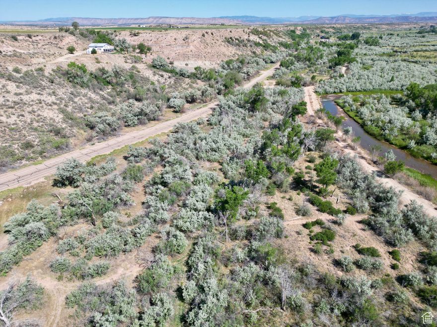 Amazing and unique opportunity to own over 11 acres on River Road within city limits. Many possibilities with this land.  Build your dream home or subdivide and develop.  City utilities are stubbed at the south end of the property.  Arrangements would need to be made with the city to bring the utilities onto the property.   The banks of the Duchesne River are steps away from this land.  Property is about .3 miles past the Duchesne Elementary School on River Rd. There is an additional 7.6 acre lot to the north of this property also for sale.  Owner would be willing to negotiate a deal if the properties are bought together.  (Parcel # 00-0008-3810)  Acreage figures are provided as a courtesy estimate only. Buyer is advised to obtain an independent measurement.