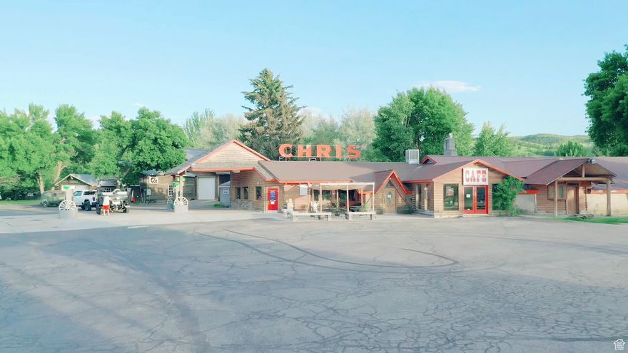 UNIQUE INVESTMENT OPPORTUNITY IN OGDEN VALLEY  9.53 Acres with a Personal Residence, Restaurant, Gas Station, Lodging, and RV Park. This rare commercial property in the heart of Ogden Valley offers a dynamic investment opportunity with multiple revenue stream options across 9.53 acres. The property consists of three parcels - 210310013, 210310023, and 210310030 - zoned CVR-1, providing flexibility for commercial, lodging, and recreational use. Jackson Fork Inn: A Historic Landmark. Originally built in 1936 as a working dairy barn, this iconic structure was relocated to its current location following the expansion of Pineview Reservoir in the 1950s. Over the years, it has housed a private club, a restaurant, and an inn. The property includes a personal residence on its southern end, adding to its potential as a hospitality or event space. Chris' Restaurant, Convenience Store & Gas Station: Built in 1961, this 6,921 sq. ft. restaurant and convenience store operates as a Sinclair-branded gas station, with two years remaining on the fuel contract. This well-established business is a central stop for both locals and visitors to the area. Additional Commercial Buildings & Recreational Business. Two large outbuildings, one currently used for equipment storage. The second was home to Ogden Valley Sports, offering seasonal rentals for paddle boards, kayaks, and personal watercraft in the summer. In winter, it has served as a mechanic's garage specializing in snowmobile upgrades and repairs. RV Park & Water Rights: A 13-space RV park, typically operating from April to October, providing a steady seasonal income. Two wells supply the property: one for Jackson Fork Inn and one for Chris' Restaurant, with a total water allocation of 7.02 acre-feet. 9 shares of irrigation water from the Huntsville South Bench Canal are available for purchase separately. This multi-use property presents an exceptional opportunity for an investor, business owner, or developer looking to capitalize on the area's tourism, recreation, and commercial demand. Whether maintaining its current uses or exploring new development, the potential here is vast. For more details or to schedule a private tour, contact us today! Square footage bedroom/bathroom figures are estimates only as there are multiple buildings. See attached memorandum for full details. Buyer is advised to obtain an independent measurement.
