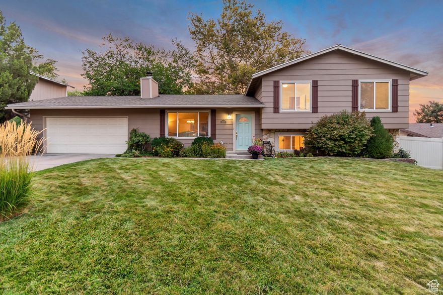 DON'T MISS OUT ON THIS BEAUTIFUL EAST SIDE GEM! Located in one of Sandy's most desirable neighborhoods, this 4-bedroom, 3-bathroom home offers the perfect combination of comfort, style, privacy, and convenience. MAIN FLOOR features a living room with vaulted ceilings and a cozy fireplace, creating a warm, open atmosphere. Enjoy peaceful evenings by the fire while taking in breathtaking mountain views right from your window. The kitchen features granite countertops, a brand-new stove, black appliances, and sliding glass doors that open to a fully fenced, PRIVATE BACKYARD surrounded by mature trees. It's the ideal space for relaxing or entertaining, complete with a covered patio, playset, tree swing, shed, and even a vegetable garden. UPSTAIRS, you'll find two bedrooms and a full bath, along with a master bedroom that includes a walk-in closet, a beautifully remodeled bathroom, and access to a private balcony-perfect for unwinding in the evenings. The DAYLIGHT BASEMENT offers even more living space, including a family room and sliding glass doors that lead to the covered patio. An additional bedroom or office, a bathroom with laundry. A large hidden storage area is tucked behind the bedroom door for added convenience. PRIME LOCATION AND LIFESTYLE PERKS: You're just minutes from the Cottonwood Canyons, with quick freeway access and close proximity to shopping, restaurants, and grocery stores. Enjoy live music all summer long at the nearby Sandy Amphitheater, cool off at the local splash pad, or take a short walk to Flat Iron Park. Falcon Park is also just minutes away.  WELCOME HOME!