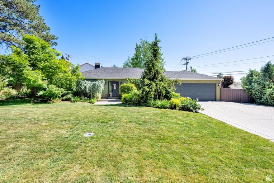 Rare Holladay Opportunity! This beautifully maintained home is located in one of Holladay's most desirable neighborhoods, surrounded by mature trees that provide natural beauty and privacy. Inside, you'll find hardwood and travertine flooring, crown molding, and plantation shutters throughout and it's freshly painted, making it truly move-in ready.  The recently renovated kitchen features stainless steel appliances and a functional layout, perfect for everyday living and entertaining. The home offers 3 bedrooms and 2 full bathrooms on the main level with a spacious recreation room, bedroom, full bath and storage in the lower level. The fully fenced back yard is private and peaceful. Major updates include a new HVAC system, a new water softener, and a radon mitigation system. It's just a short walk to Cottonwood Elementary School, one of the areas top-rated schools. Don't miss this rare opportunity...Come see!
