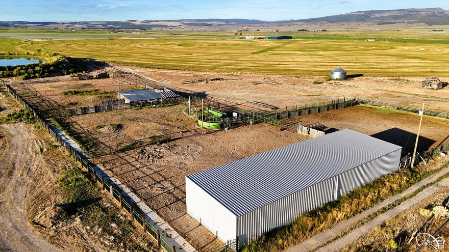 This 207-acre agricultural property in Garfield County, Utah, offers a prime opportunity for hay production or a cattle operation with a combination of high-elevation land, modern irrigation systems, and high-quality forage. With 116 acres under pivot irrigation, the property utilizes a rotational planting system of Alfalfa, Triticale, and Timothy. The farm consistently yields 5 to 6 tons per acre annually, thanks to a robust water system, irrigation shares, and a well-established irrigation plan. The hay produced here is highly valued for its quality. Dairy One Forage Testing has placed all three crops in the 'high' quality category, which includes measures like Dry Matter, Crude Protein, ADF, NDF, TDN, and overall feed value. The farm's output is regularly sold to top-tier horse breeders and owners, including those involved in championship-level rodeo events. This farm's hay is recognized for providing the essential nutrients needed to support high-performance horses. Improvements to soil health and crop management practices have been ongoing, which has helped reduce the need for chemical fertilizers and pest control products. The owner has utilized Staheli West steamers for curing and invested in covered hay barns to protect the hay and ensure its quality is maintained throughout the year. The property includes a 25,000 square-foot hay barn located at the southwest corner of the parcel, offering ample storage and easy access. Additionally, a 3,000 square-foot, three-sided shed provides additional storage space for equipment and supplies. There is also an animal drinker and over 150 Elus of water rights, held by Utah WR 61-224, ensuring that irrigation needs can be met year-round. The updated water delivery system includes holding ponds and a new custom pivot system that utilizes a Variable Frequency Drive (VFD) to manage water flow efficiently. This property's infrastructure is supported by excellent road access, including paved roads to the property and gravel roads leading to the hay barn. The internal road network makes it easy to move equipment and manage the land, while the strategic location-approximately halfway between Salt Lake City and Las Vegas-offers easy access to both major markets and recreational opportunities. The surrounding area offers access to a variety of outdoor activities, including nearby Bryce Canyon National Park, Zion National Park, and Brian Head Resort. In addition, the property is close to Panguitch, making it a convenient location for local services and amenities. The property does not include equipment, but the owner is open to negotiating the purchase of necessary equipment separately. Additional acreage may also be available upon request. Interested parties are encouraged to reach out to the listing agent for more details.