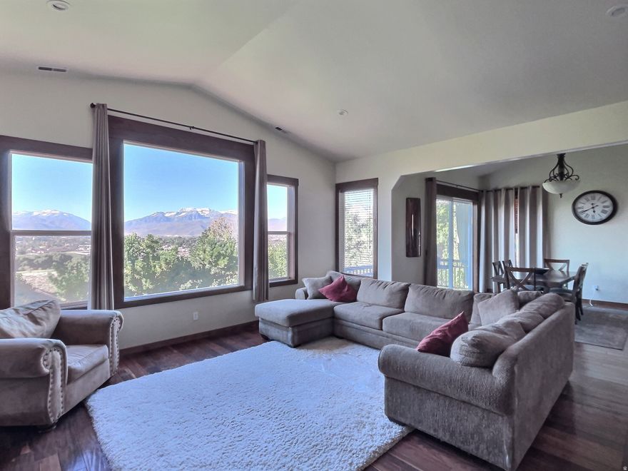 Seller offering $25,000.00 toward an interest rate buydown with a full price offer. Luxury custom home with SPECTACULAR views-no HOA!  Located just 10 minutes from the Deer Valley Gondola, 20 minutes to downtown Park City, and minutes to multiple golf courses and reservoirs, this beautifully renovated residence offers effortless access to world-class skiing, hiking, and year-round recreation. Step inside to soaring vaulted ceilings up to 19 feet on the main level and a full walkout lower level featuring 12-foot ceilings. The private front and backyard are framed by mature trees (including multiple fruit trees), creating a serene mountain retreat. No expense was spared in the renovation, updating the kitchen, bathrooms, and flooring throughout. Highlights include a gourmet chef's kitchen with a professional-grade gas range and an oversized 67-inch fridge/freezer, dual master suites (one on each level), two-way gas fireplaces in both master suites and main living areas, and laundry conveniently located in the main floor master closet, with flex space for an optional laundry area or kitchenette on the lower level. Throughout the interior, you'll find Acacia hardwood floors, solid wood doors, cabinets, closets, casing, and molding. The home is ideally situated, featuring extra-large, south facing windows that provide stunning views year round and passive solar heating in the winter.  Complementing the home's thoughtful design is a spacious three-car garage with extra-deep bays, ideal for storing recreational gear or accommodating larger vehicles. Enjoy spacious family and great rooms on both levels, plus a dedicated home theater. This is a rare opportunity to own a truly remarkable home that blends luxury living with stunning natural beauty.