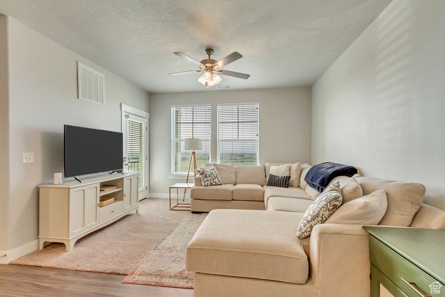 The location alone set this condo apart. It makes for quick access to I-15. Discover low-maintenance living in the sought-after Wildflower community of Saratoga Springs! This home is essentially brand new and has 3 bedrooms, 2 bathrooms, and a spacious garage with extra storage and a pop-out perfect for a workbench or hobby space.  Enjoy breathtaking views of Utah Lake right from your home, along with modern finishes, an open-concept layout, and plenty of natural light. Conveniently located near parks, trails, and shopping, this is the ideal spot for comfort and convenience. Schedule your private tour today! Buyer to verify all listing information, including sqft.