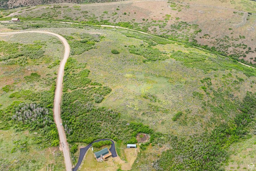 You may have dreamed of living close to town but yet.... far enough away to have a full sense of privacy. Herriman has a coveted little canyon community called Hi Country Estates II.    Here you will find the hustle and bustle fade away as you drive the pavement toward Yellow Fork Trailhead. Turn left as your mind relaxes and your wheels hit the gravel  leading home.    Imagine pulling into your private driveway and your entrance is encased in scrub oak allowing your main home and land to be hidden off the main road. Tucked behind mature trees the view opens up and endless acres of land lead to a stunning backdrop of downtown SLC and the Wasatch front. This parcel is 2.5 acres and can be bought individually or with lot 120B as a drool worthy 5 acre parcel. Ideal for someone who already has their GC in mind and home plans ready for approval. luxury living, homestead, horse property. Extended archery Mule deer units. You dream it.. now let it become reality.  Swing by today and don't forget to bring closed toed shoes and truly walk the property for the full effect. Raw land. Buyer due diligence on utilities connections etc.