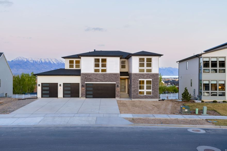 Stunning home with soaring two-story ceilings in the great room and breathtaking mountain and valley views. The gourmet kitchen and professionally designed interior finishes create a warm, elevated living experience throughout. The luxurious primary suite features separate vanities and an oversized standalone tub, while a main-floor guest suite and finished basement with two additional guest suites provide exceptional flexibility for hosting or multigenerational living. An upstairs loft offers the perfect hangout or bonus living space.  Uniquely designed, this home is as inspiring as it is functional.