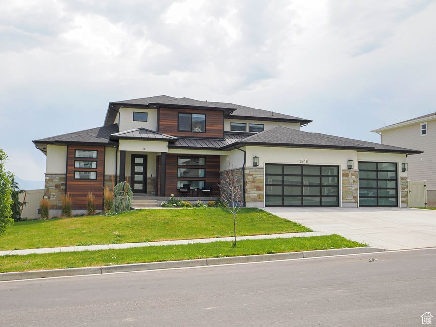 Located in Saratoga Springs, this beautifully designed residence combines modern luxury with timeless comfort. Featuring 3 bedrooms-including a spacious primary suite on the main level-and 2.5 baths, this home is thoughtfully designed for both relaxation and entertaining. The expansive open-concept floor plan is enhanced by soaring vaulted ceilings and large windows that flood the space with natural light. At the heart of the home, the gourmet kitchen boasts quartz countertops, double ovens, a built-in refrigerator, and ample cabinetry-perfect for hosting or everyday living. A main-level office offers a quiet, private workspace, while the primary suite serves as a serene retreat with a generous walk-in closet and a spa-inspired bathroom. The unfinished basement provides endless potential to tailor the space to your lifestyle.  Enjoy breathtaking views of the surrounding mountains and sparkling lake, with effortless access to outdoor activities including boating, hiking, and biking. This is more than a home-it's a lifestyle of elegance, comfort, and natural beauty.