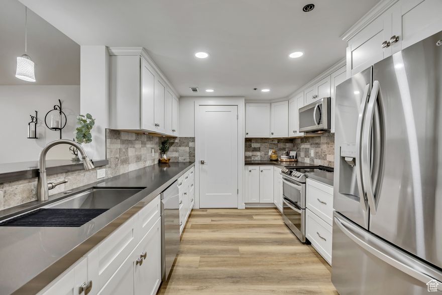 Welcome home! You will love this newly updated condo in the heart of downtown. This condo was lovingly remodeled from top to bottom with amazing attention to detail. The bright open concept living room and kitchen are perfect for entertaining. You will love the unmatched location and amenities including the amazing rooftop deck with hot tub, perfect for making the most of cool fall evenings. hand ball courts, indoor pool and hot tub, and a gym.