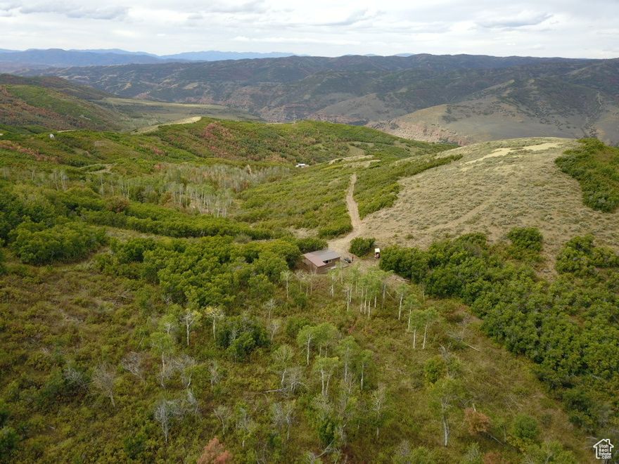 Come take a look at this mountaintop recreational lot, which includes some impressive views and your own private bunkhouse! This lot is just over 23 acres and there is leveled flat spot at the top of the lot where a bunkhouse has been built and is wired for generator hook-up! If you want a secluded mountain lot away from the hustle and bustle of the city or maybe you want your own private land to hunt on, this property is for you! This is a gated community, you will need a key and an agent to accompany you on any showings. Year-round access is possible with Snowmobiles or ATV/UTV with tracks. No winter road maintenance so the road is not plowed.
