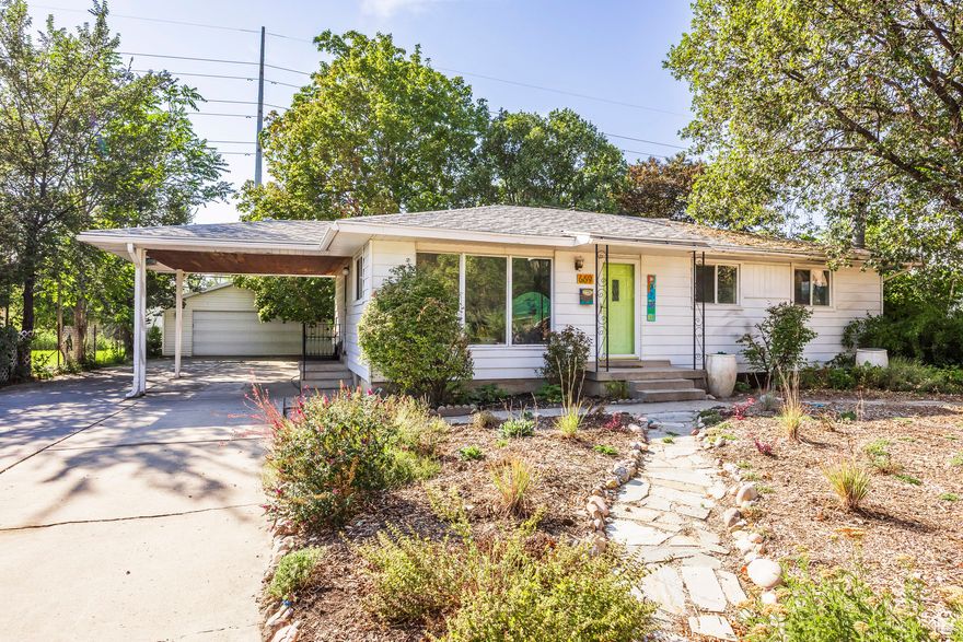 Welcome home to this charming Rose Park home! With its oversized, fenced yard and double car garage, it already has four stars! This four bedroom, two bathroom abode is located on a quiet street in the lovely Rose Park neighborhood (where all the streets are named after roses!). Bright, airy and full of sunlight, this darling home just FEELS good when you walk in - the living room is spacious with large picture windows facing the street. There is a large bedroom with an oversized closet and a smaller bedroom on the main floor. The kitchen looks out onto the expansive yard with a cozy patio and tons of room to run around. Downstairs is a cozy family room, two additional bedrooms and a 3.4 bath. In the backyard, there are steel planter boxes and two sheds in the back (one was once an artist's studio), along with the oversized two car garage. Hurry!