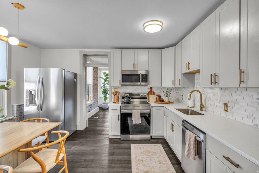 Timeless charm and modern updates in this cozy turn of the century brick home, nestled in the sought-after east of freeway accessible neighborhood. There is so much character packed into this lovely home. Exposed stone on the inside of the living room add to the vibrance and originality. Fully renovated master bathroom with free standing tub and large shower. New bamboo flooring throughout, New Appliances and kitchen cabinets, quartz countertops and marble backsplash, Extra large master bedroom, Large closets. Outdoor fire pit area. This home is  perfect for those looking for a piece of history with all the  modern conveniences. Freestanding fireplace and washer and dryer are negotiable. Open House March 21st 2026 11am-1pm NO SHOWINGS until OPEN HOUSE