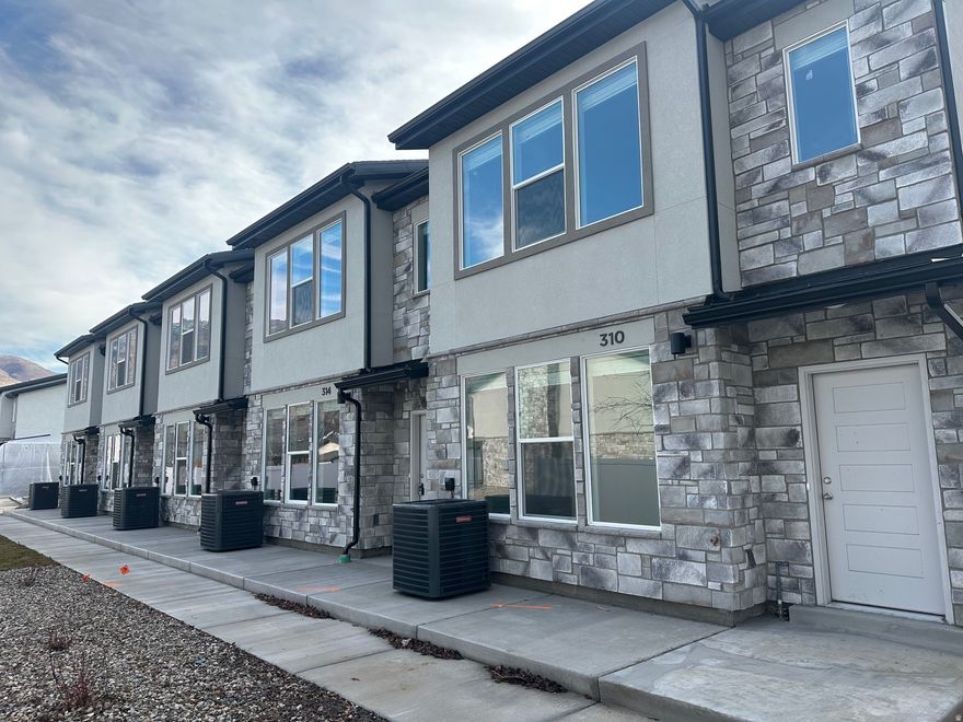 This beautifully designed 3 bed, 2.5 bath townhome is part of a new construction community located near parks, schools, and all the charm Ogden has to offer. These homes feature spacious open layouts, stylish finishes, 2-car garages. 9 ft ceilings on main level and Master Suite.  Come tour a finished unit to see the quality craftsmanship and secure your new home before they're gone! Special Incentives Available! Qualified first-time homebuyers may be eligible for a $20,000 New Build Grant covering down payment and closing costs. Photos are of a previously completed townhome by the same builder and are for illustrative purposes only. Finishes, features, and layout may vary. Square footage figures are provided as a courtesy estimate only and were obtained from build set. Buyer is advised to obtain an independent measurement.